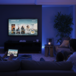 a_cinematic_nighttime_scene_inside_a_modern_living_room_with_elegant_dcor_bathed_in_warm_ambient_li_y0yed5n1u7pfeh5p5gz5_0